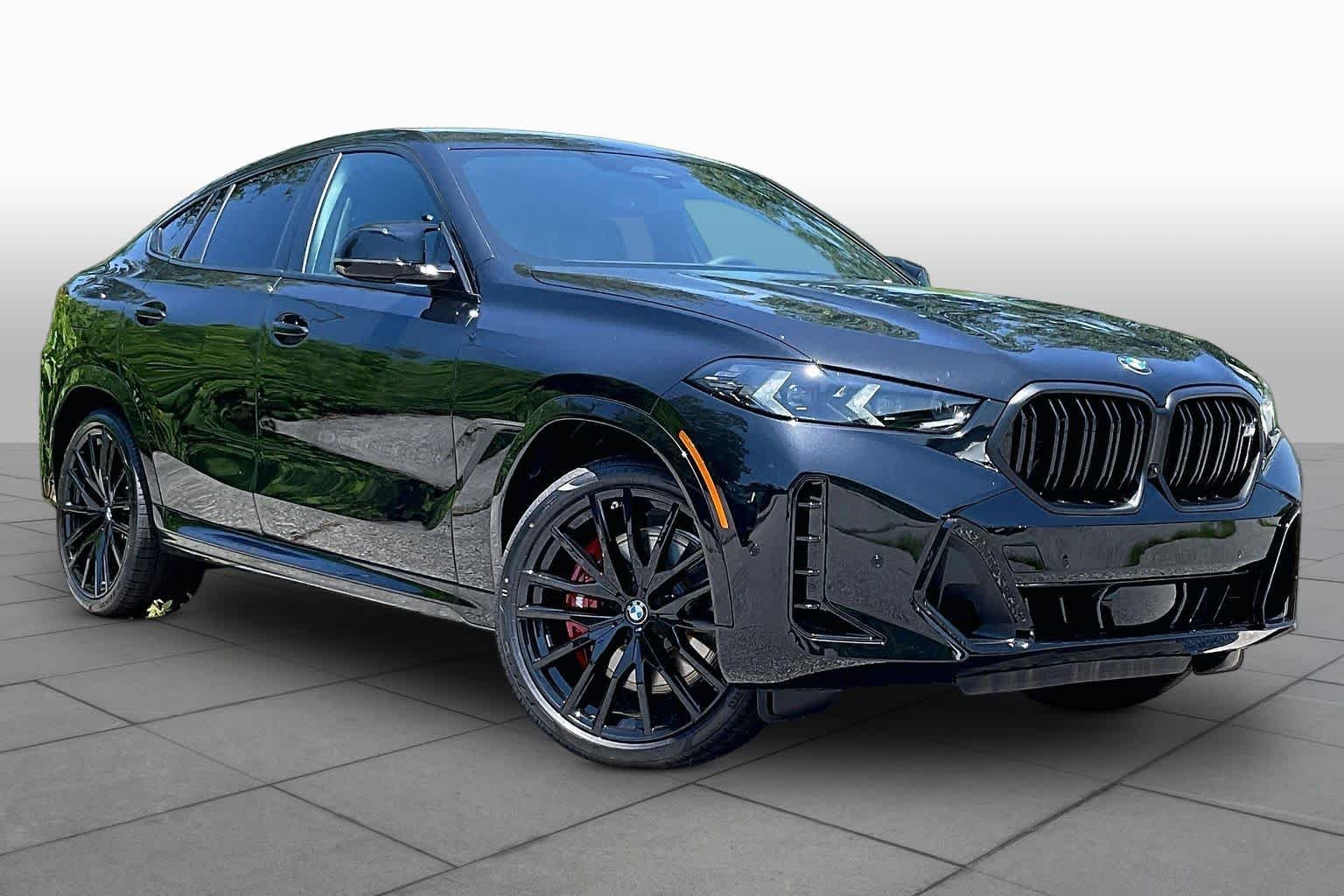 Used 2027 Black Sapphire Metallic BMW M60i image 2