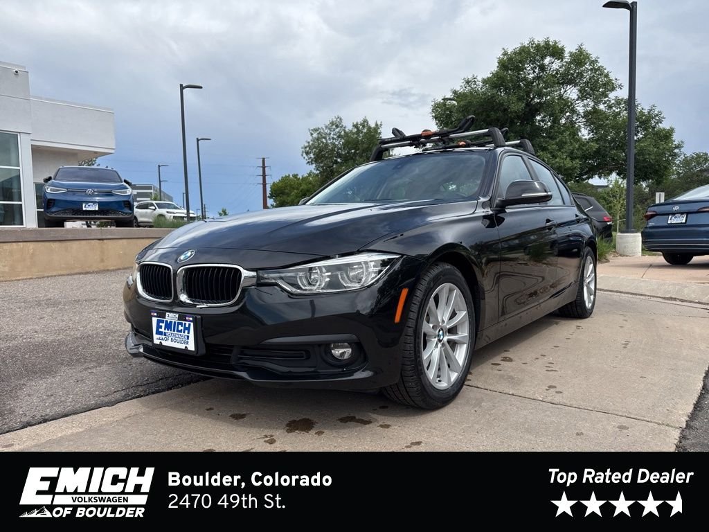 Used 2018 Black Sapphire Metallic BMW 320i xDrive image 1