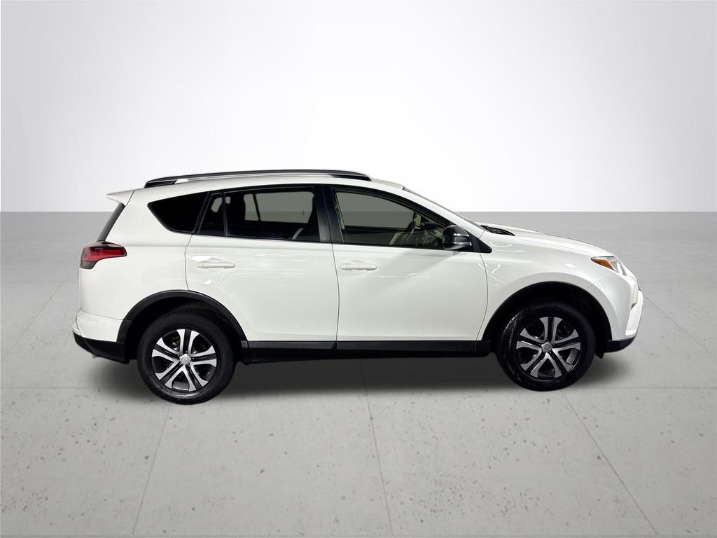 Used 2016 Super White Toyota LE image 5