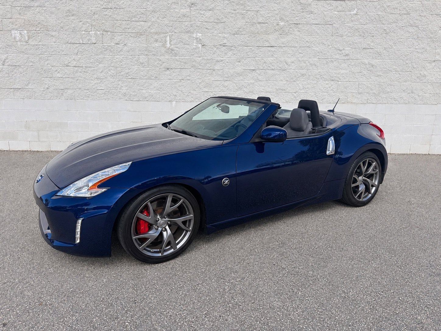 Used 2016 Deep Blue Pearl Nissan Touring Sport image 1