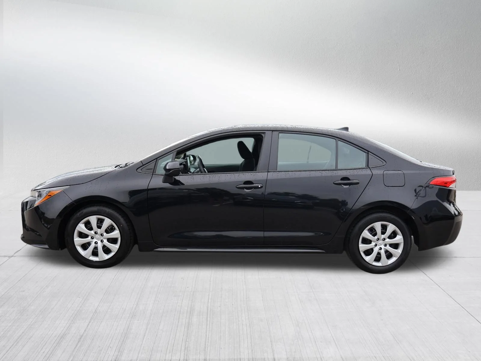 Used 2025 Midnight Black Metallic Toyota LE image 4