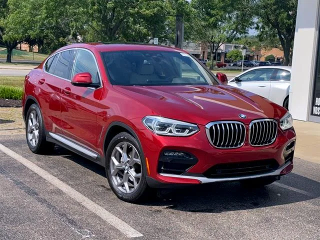 Used 2021 Flamenco Red Metallic BMW xDrive30i image 1