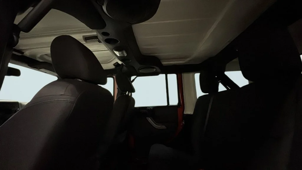 Used 2014 Orange Jeep Unlimited Sport image 14