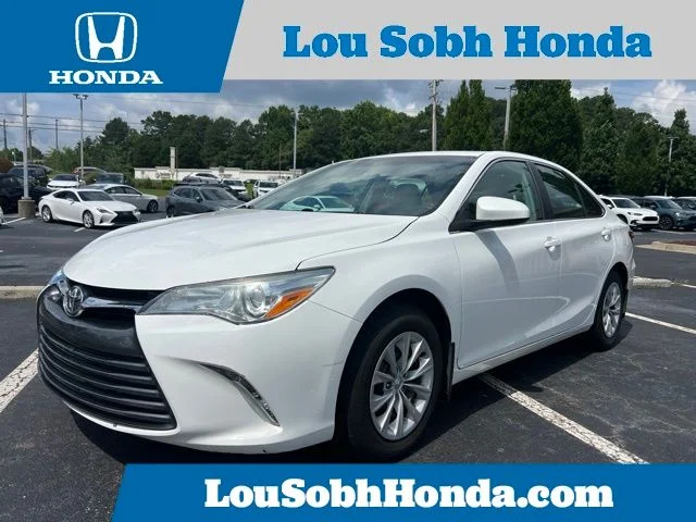 Used 2016 Super White Toyota LE image 1