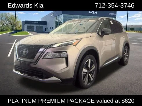 Used 2023 Gold Nissan Platinum image 1