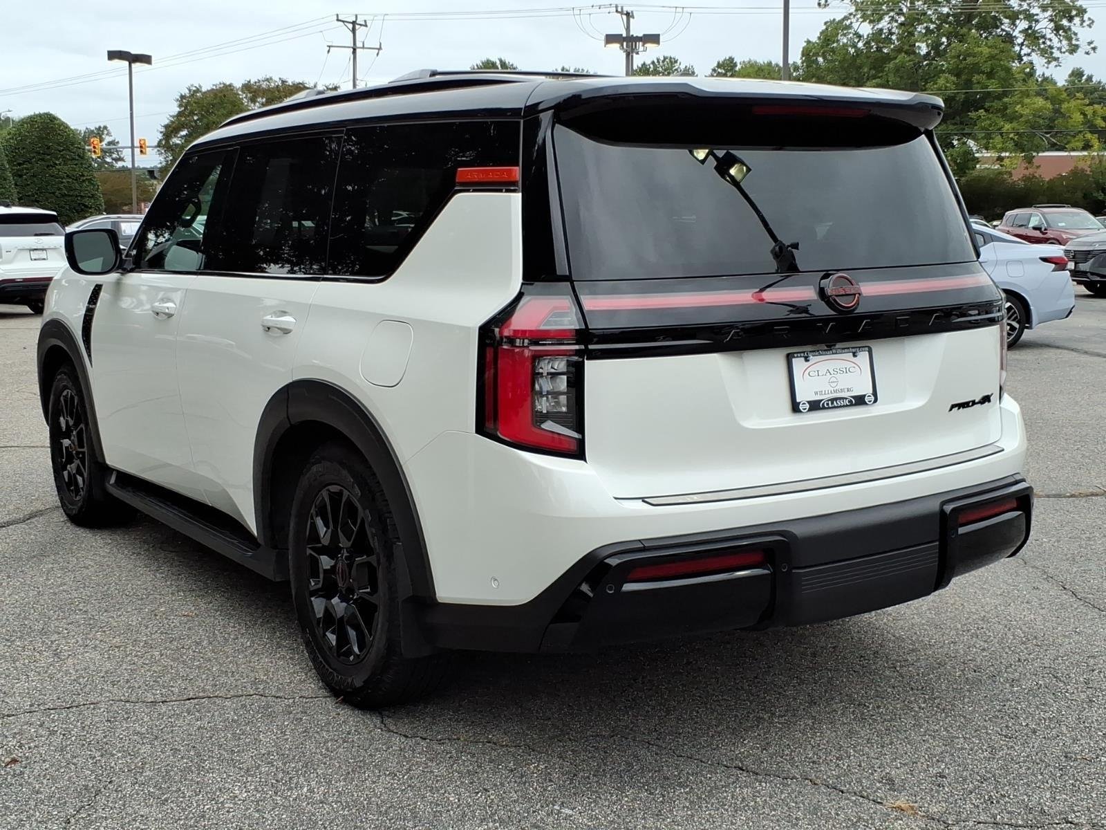 Used 2025 Aspen White Tricoat/Super Black Nissan PRO-4X image 9