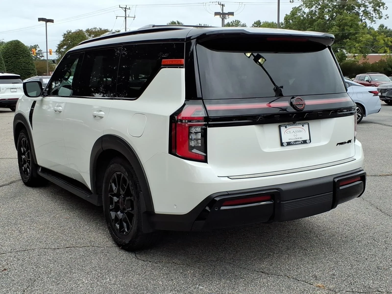 Used 2025 Aspen White Tricoat/Super Black Nissan PRO-4X image 9