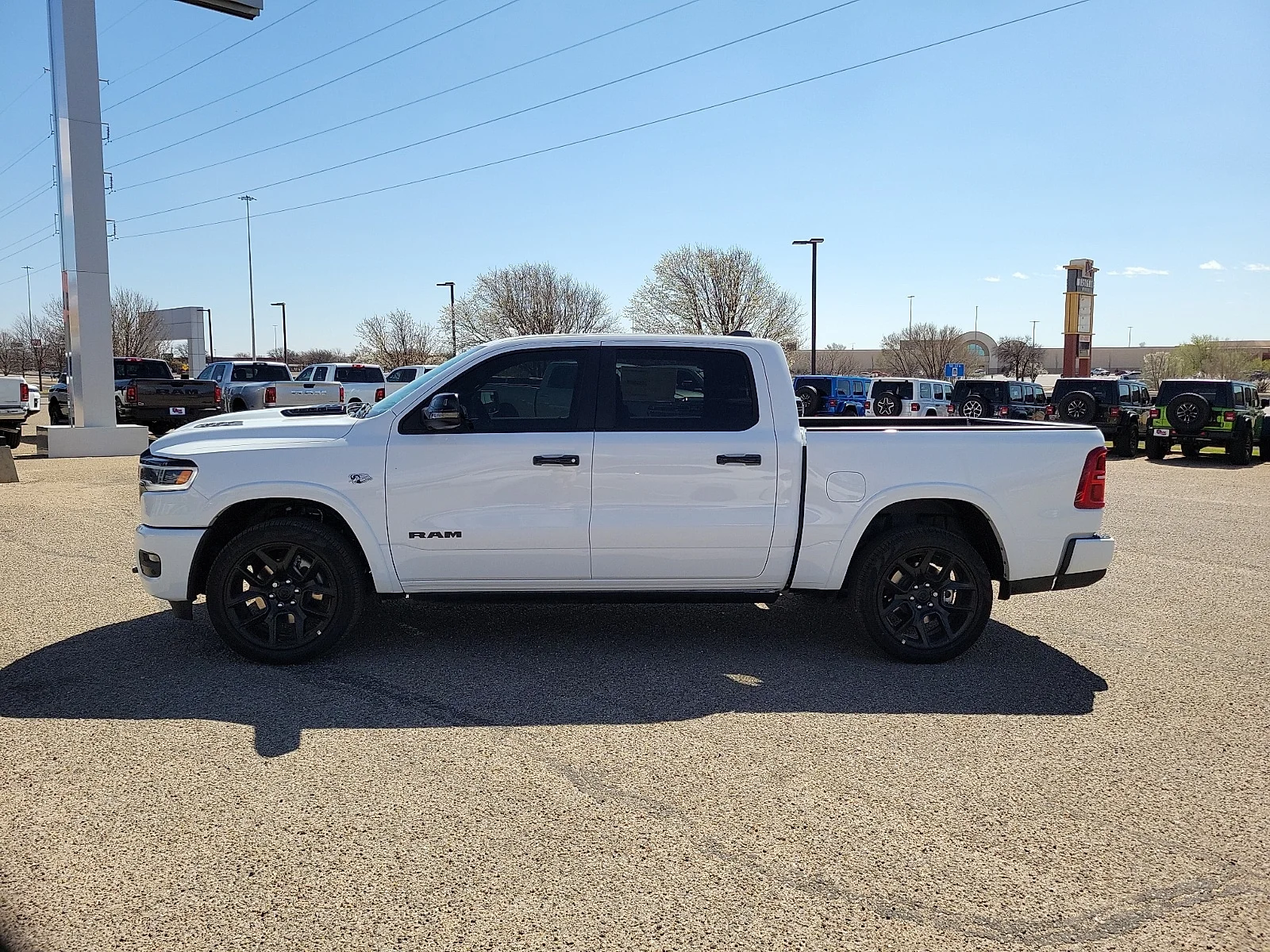 New 2026 Bright White Ram LIMITED CREW CAB 4X4 5