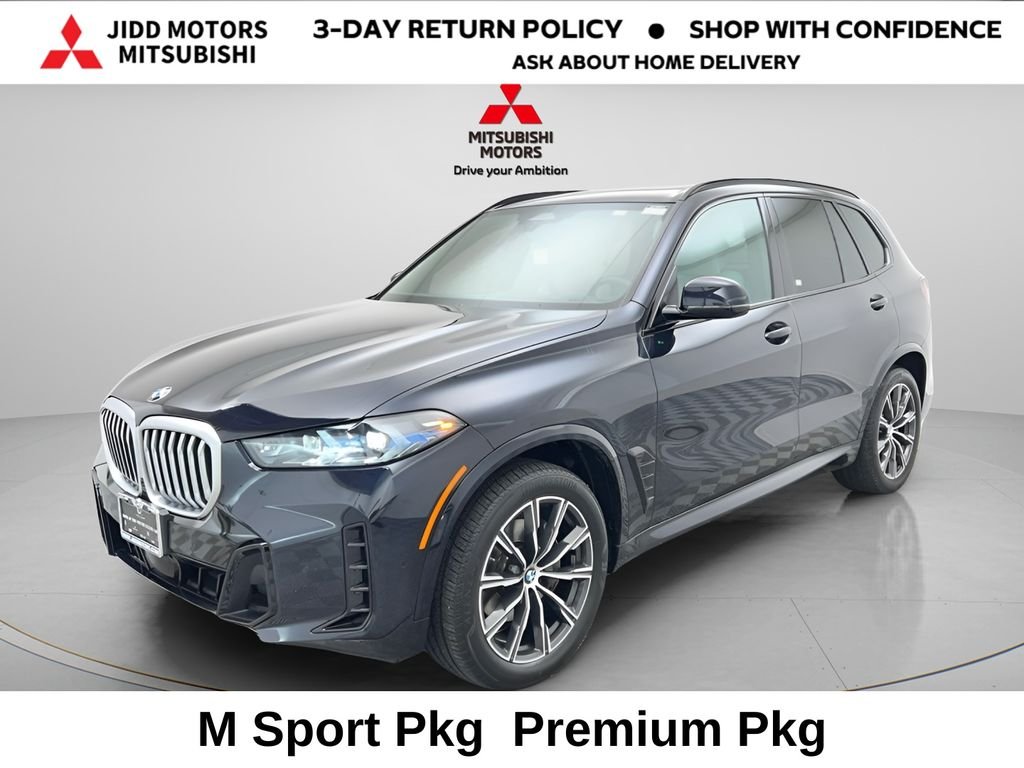 Used 2025 Carbon Black Metallic BMW xDrive40i image 1