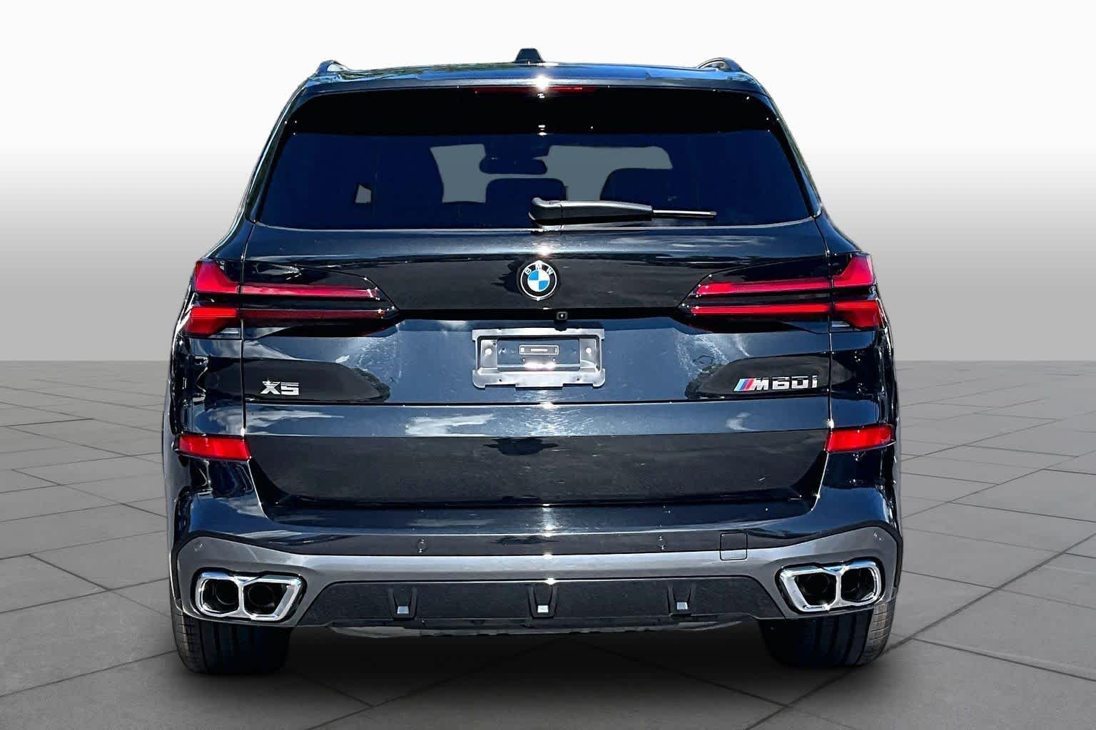 Used 2026 Black Sapphire Metallic BMW M60i image 5