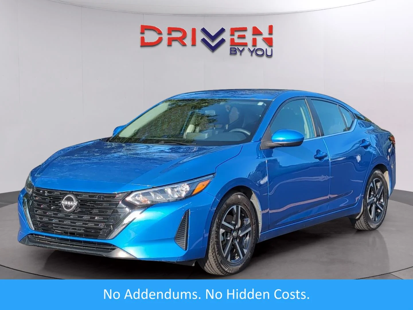 Used 2024 Electric Blue Metallic Nissan SV image 1