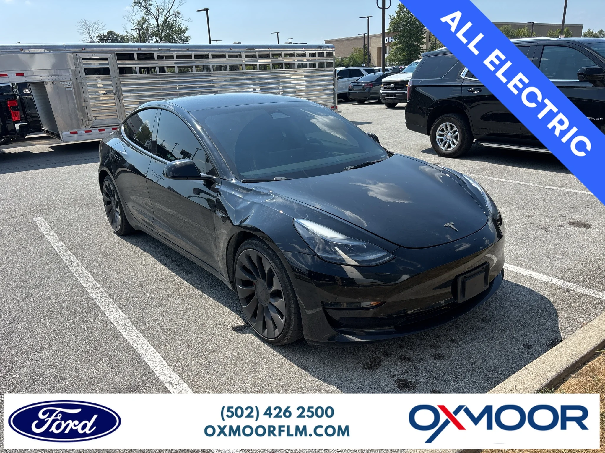 Used 2022 Solid Black Tesla Performance image 1