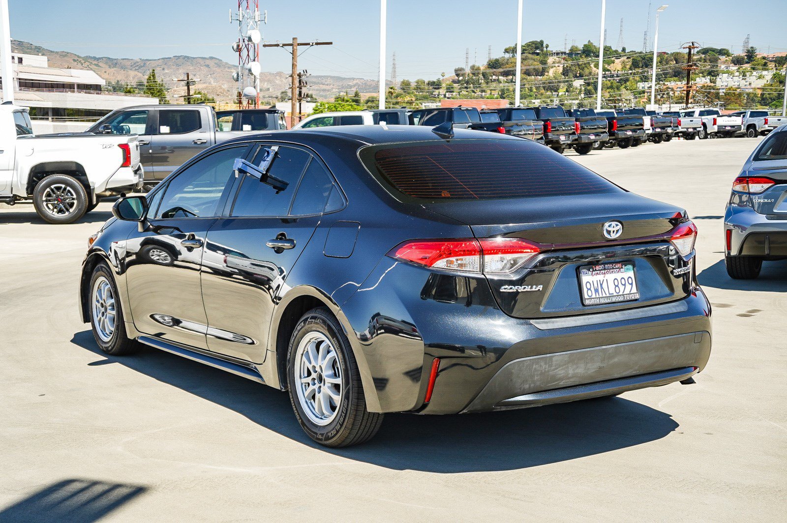 Used 2021 Black Sand Pearl Toyota Hybrid LE image 4