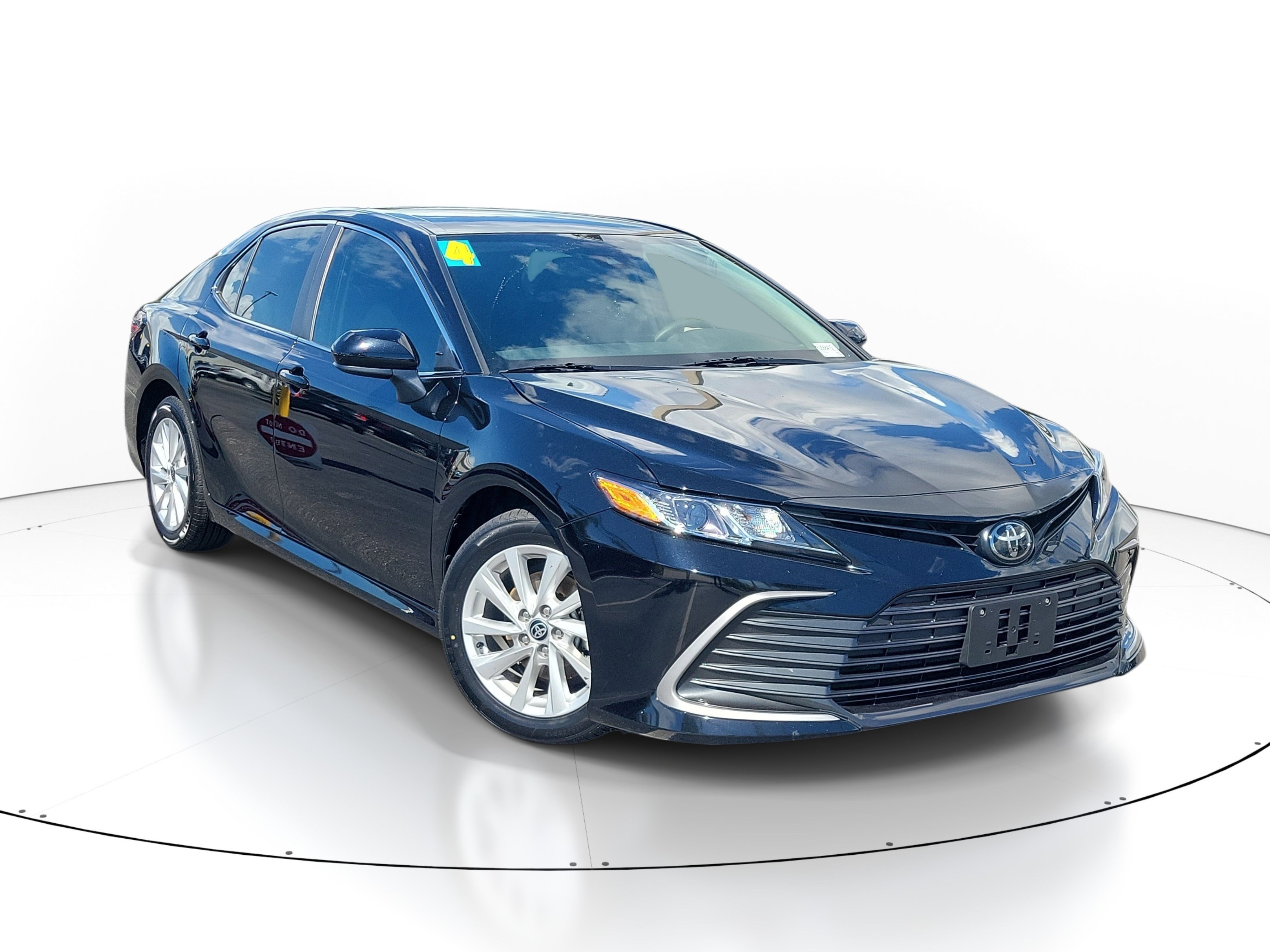 Used 2024 Midnight Black Metallic Toyota LE image 1
