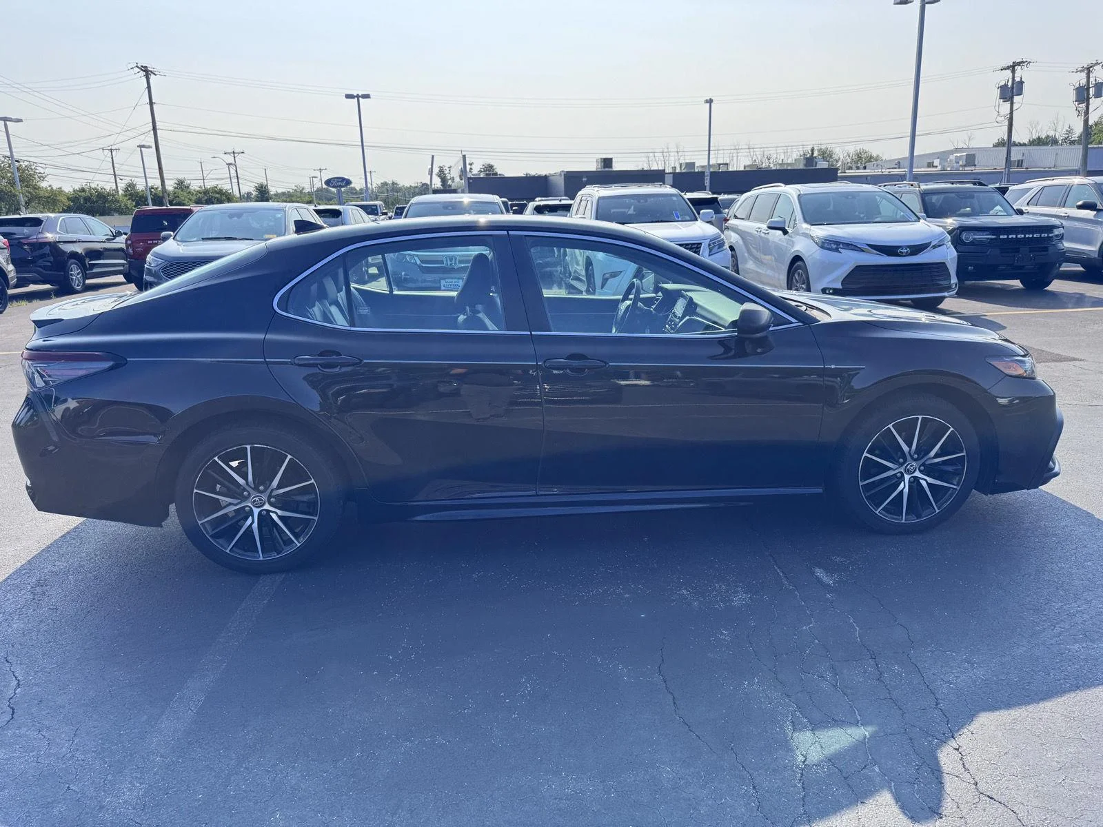 Used 2021 Midnight Black Metallic Toyota SE image 4