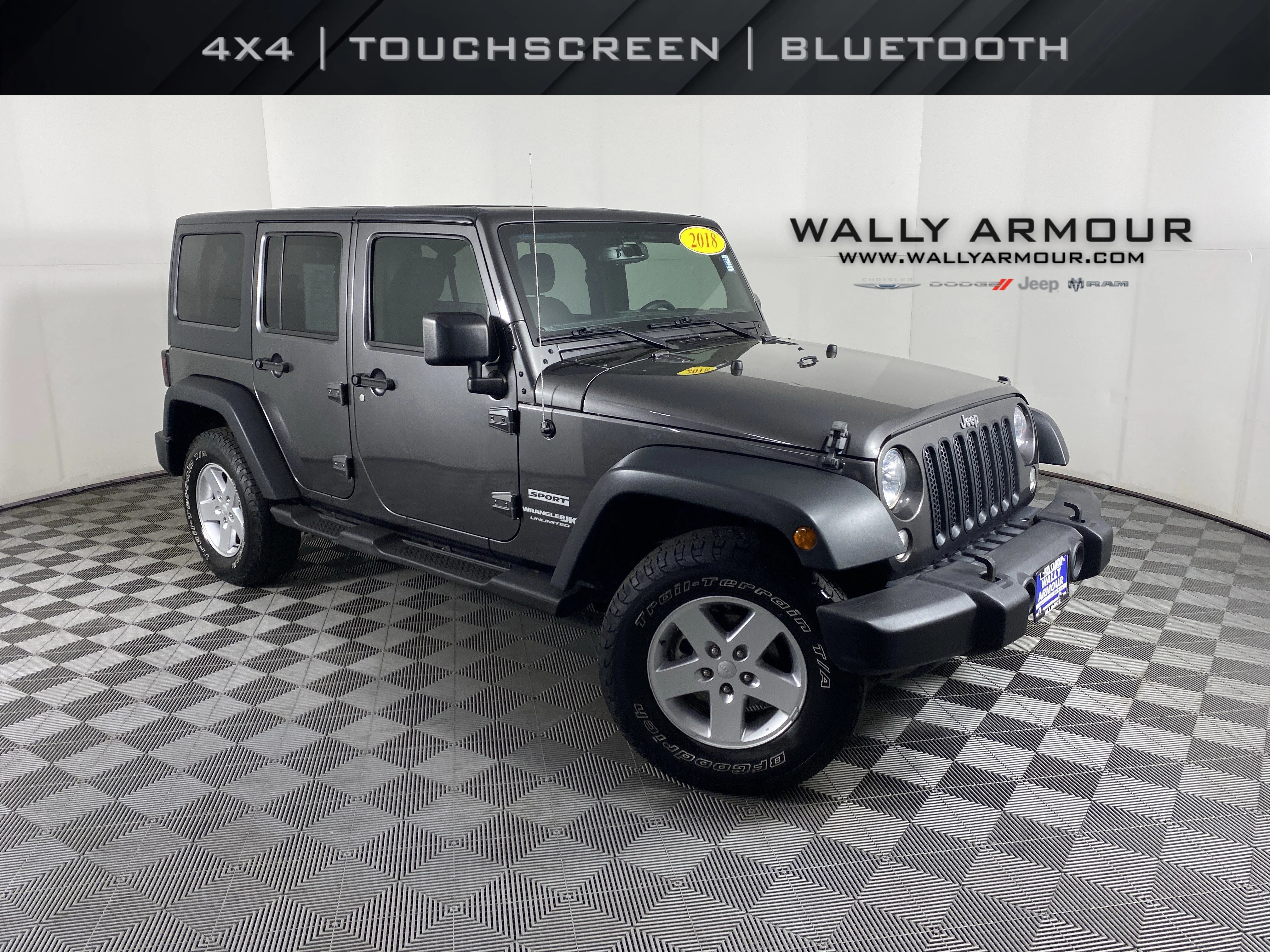 Used 2018 Granite Crystal Metallic Clearcoat Jeep Sport S image 1