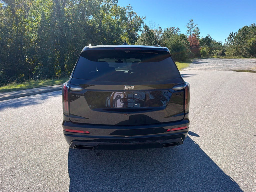 Certified Used 2024 Stellar Black Metallic Cadillac Sport image 3