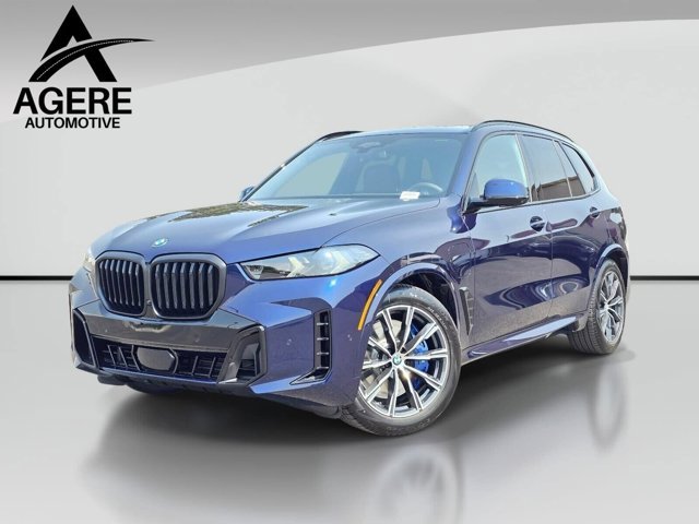 New 2026 Tanzanite Blue II Metallic BMW xDrive50e image 1