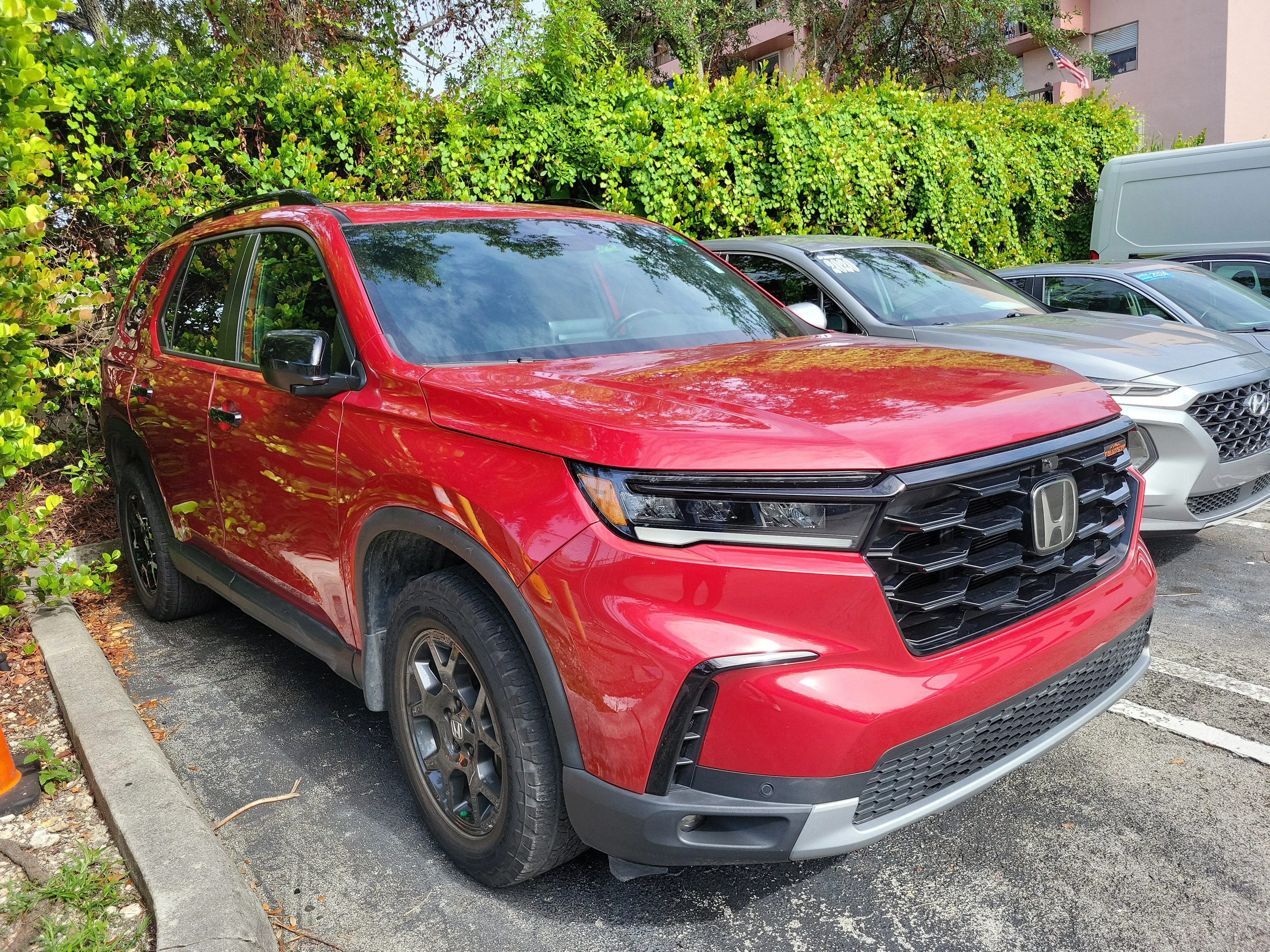Certified Used 2024 Radiant Red Metallic II Honda AWD TRAILSPORT image 2