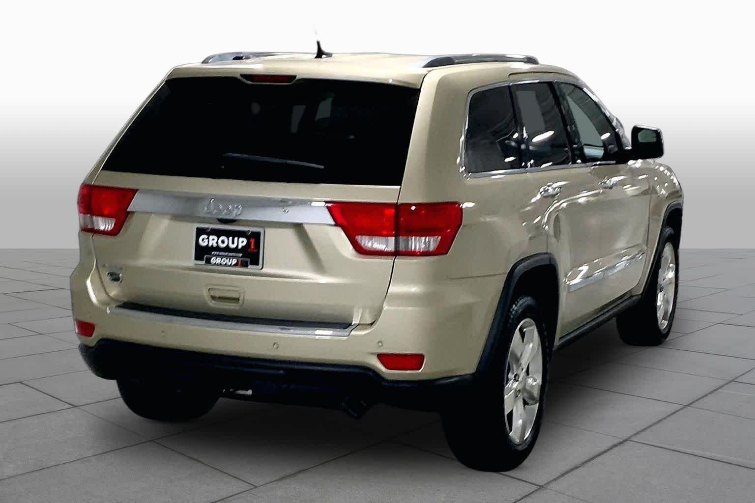Used 2011 White Gold Jeep Overland Summit image 12