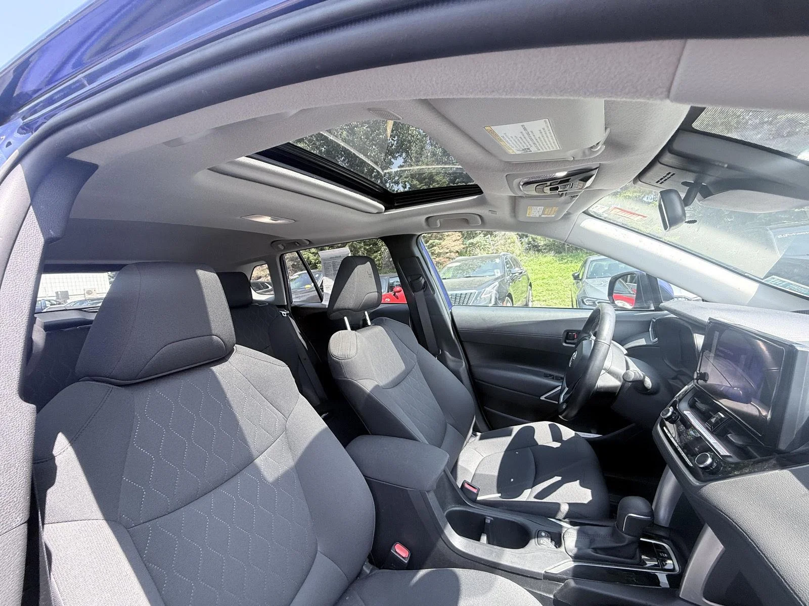 Used 2023 Blue Crush Metallic Toyota LE image 9