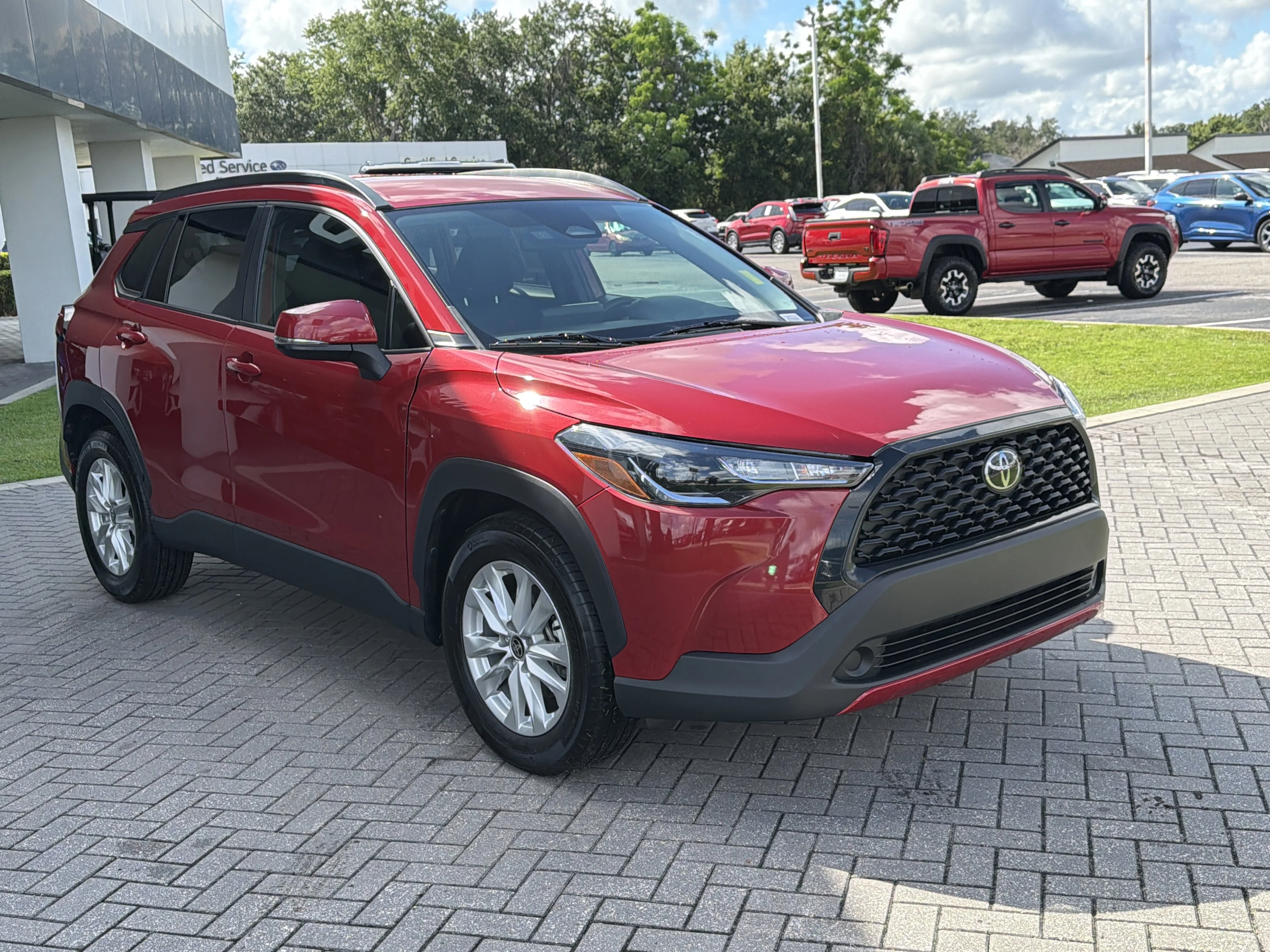 Used 2023 Barcelona Red Metallic Toyota LE image 7