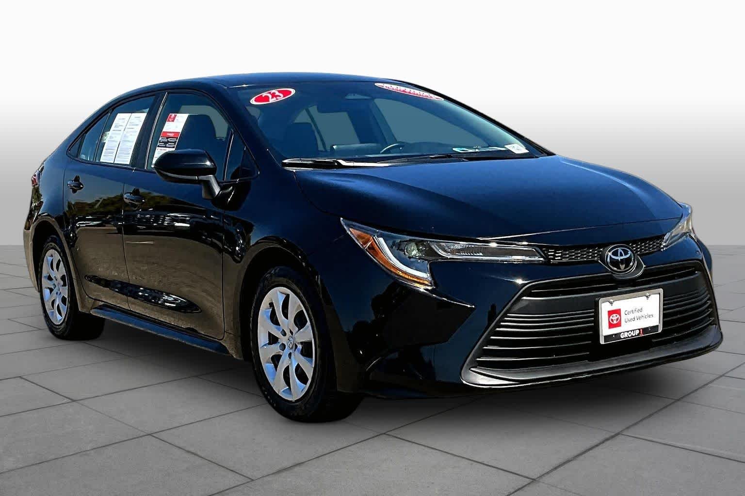 Used 2023 Midnight Black Metallic Toyota LE image 2