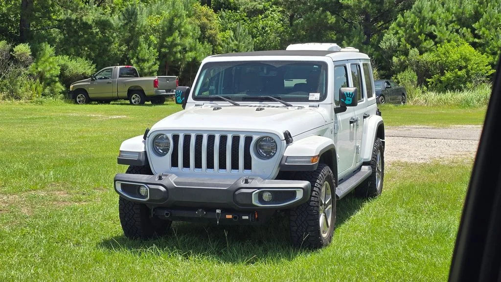 Used 2021 White Jeep Unlimited Sahara image 1