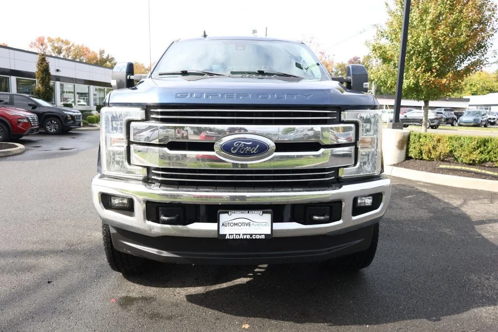 Used 2019 Blue Jeans Metallic Ford LARIAT 4WD Crew Cab 6.75