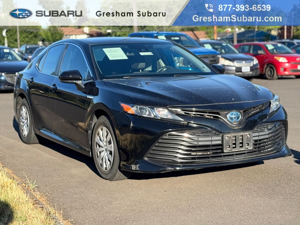 Used 2019 Midnight Black Metallic Toyota LE image 1