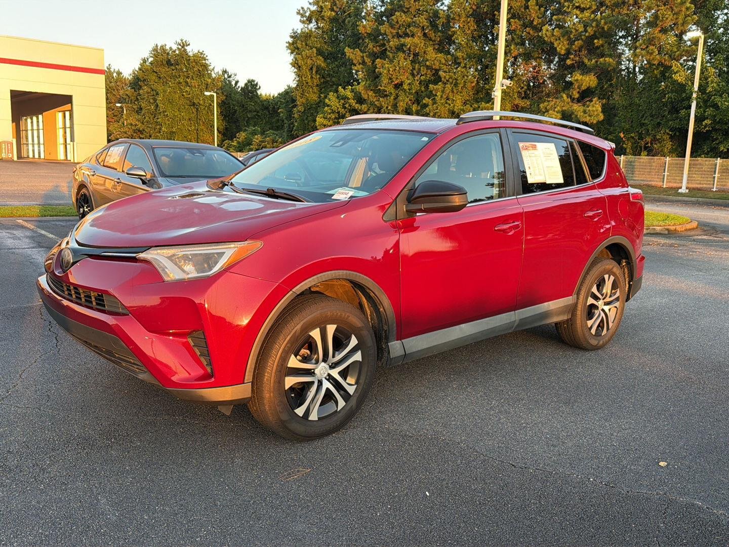 Used 2018 Ruby Flare Pearl Toyota LE image 1
