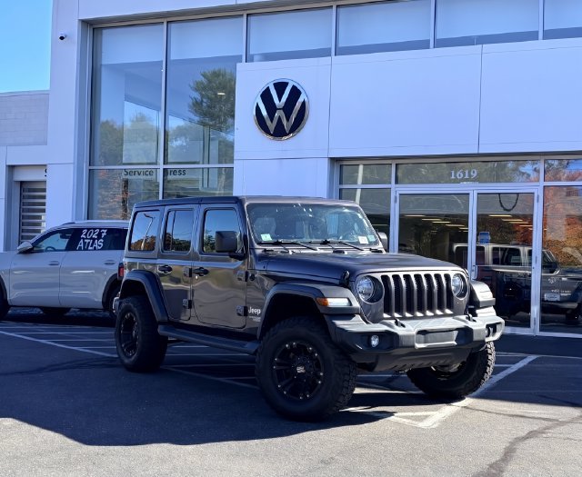 Used 2018 Granite Crystal Metallic Clearcoat Jeep Unlimited Sport S image 1