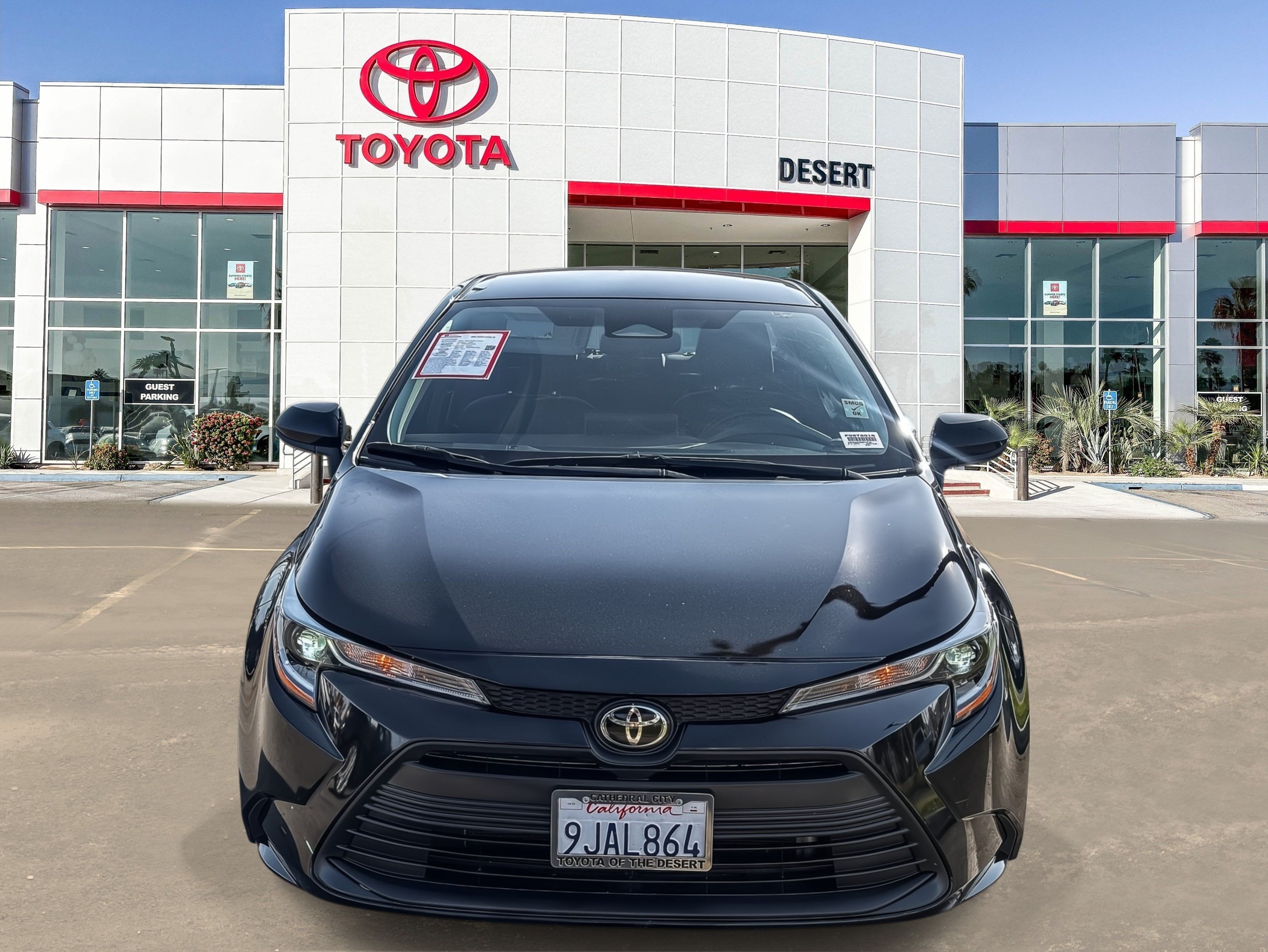 Certified Used 2024 Midnight Black Metallic Toyota LE image 2