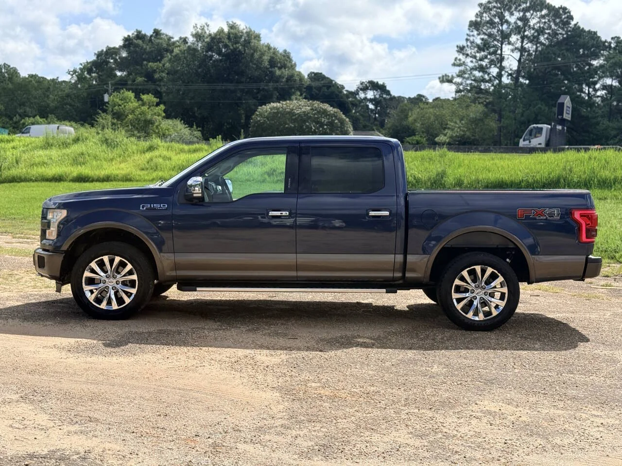 Used 2015 Blue Ford Lariat 4x4 4dr SuperCrew 5.5 ft. SB image 2