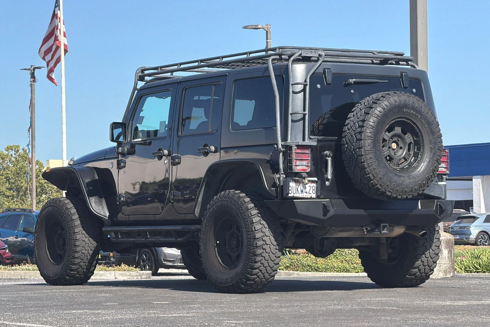 Used 2013 Black Jeep Unlimited Sport image 6