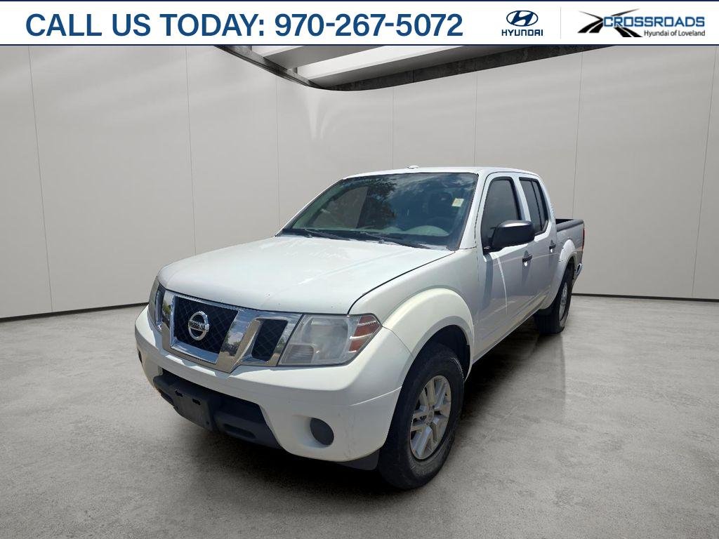Used 2016 Glacier White Nissan SV image 1
