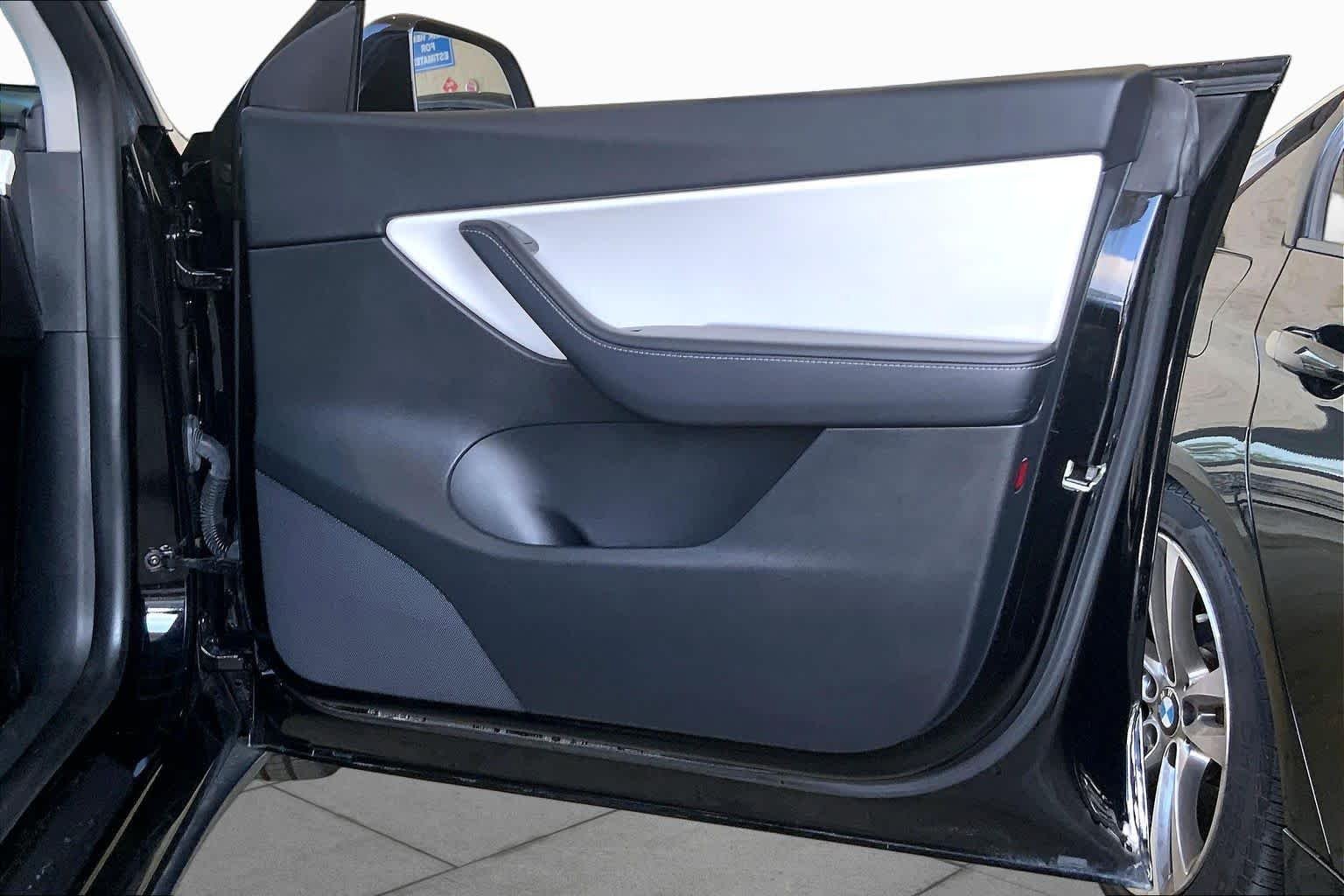 Used 2021 Solid Black Tesla Performance image 22