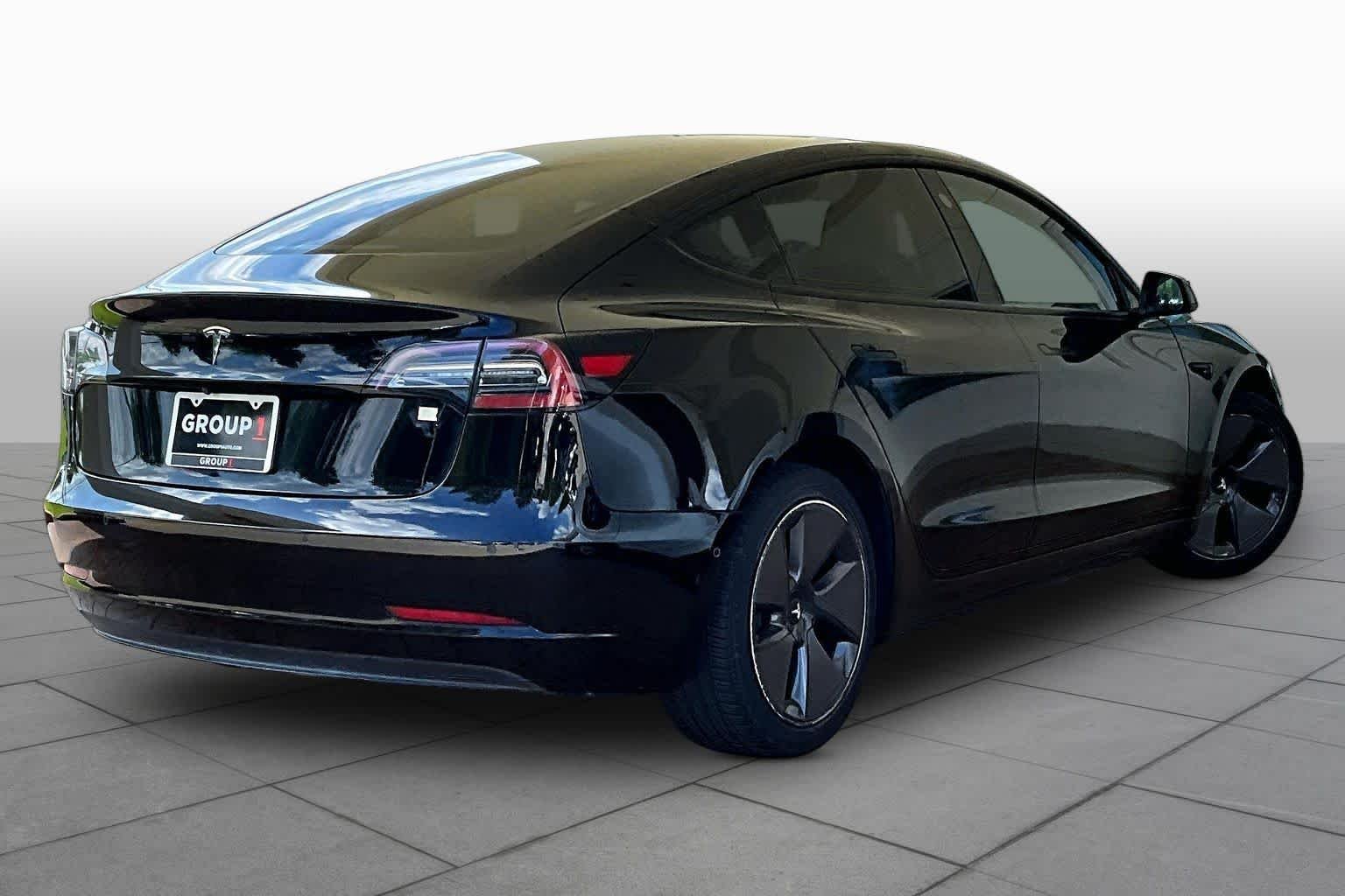 Used 2021 Solid Black Tesla Standard Range Plus image 10