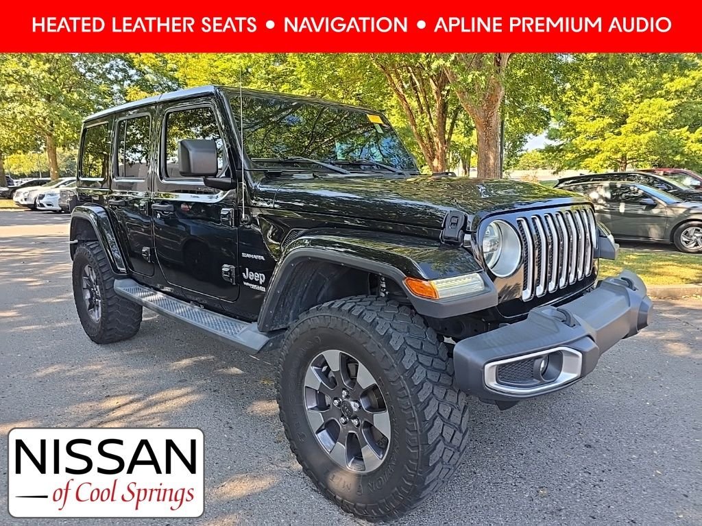 Used 2018 Black Jeep Unlimited Sahara image 1