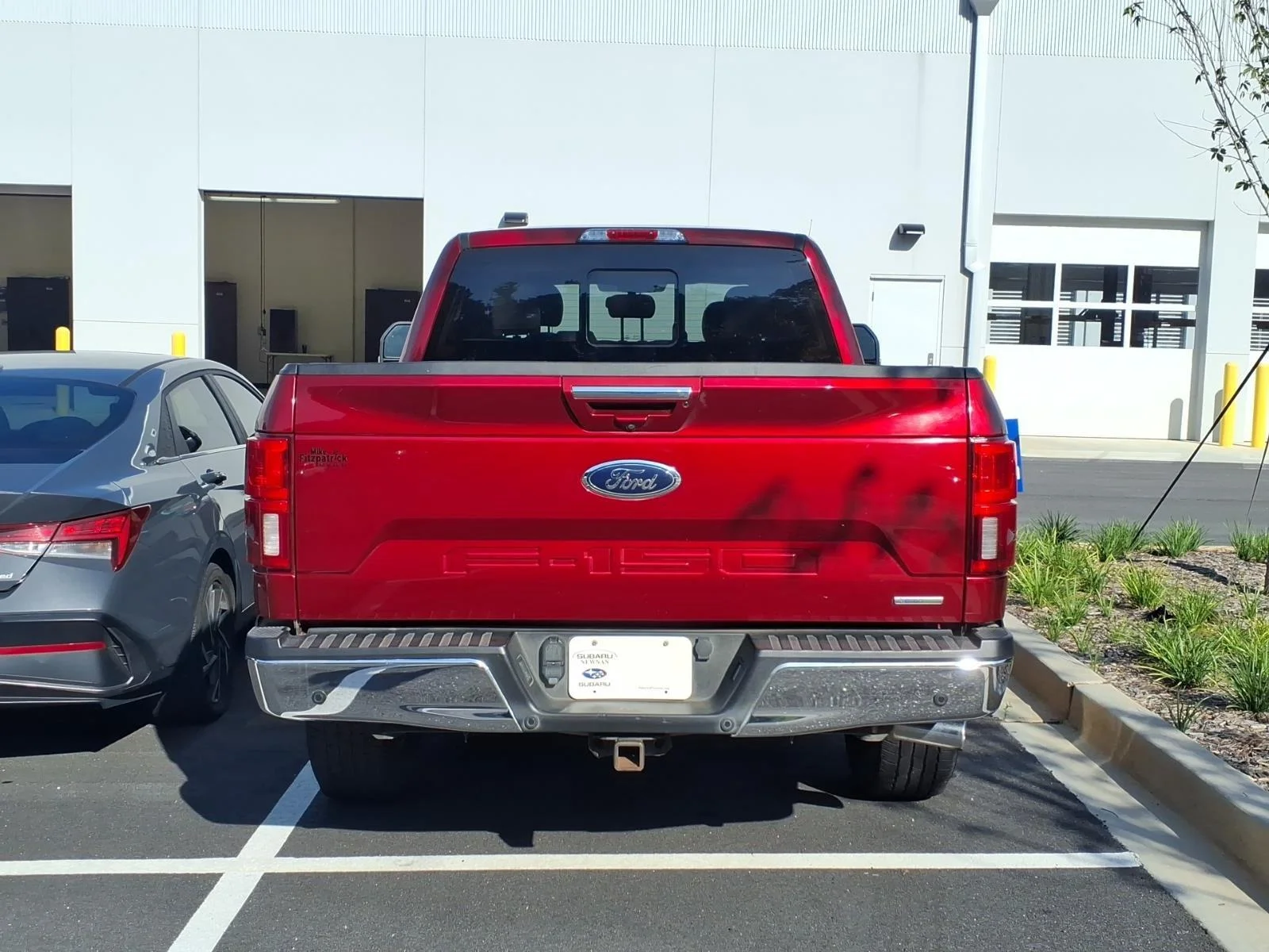 Used 2018 Ruby Red Metallic Tinted Clearcoat/Stone Gray Ford LARIAT image 4