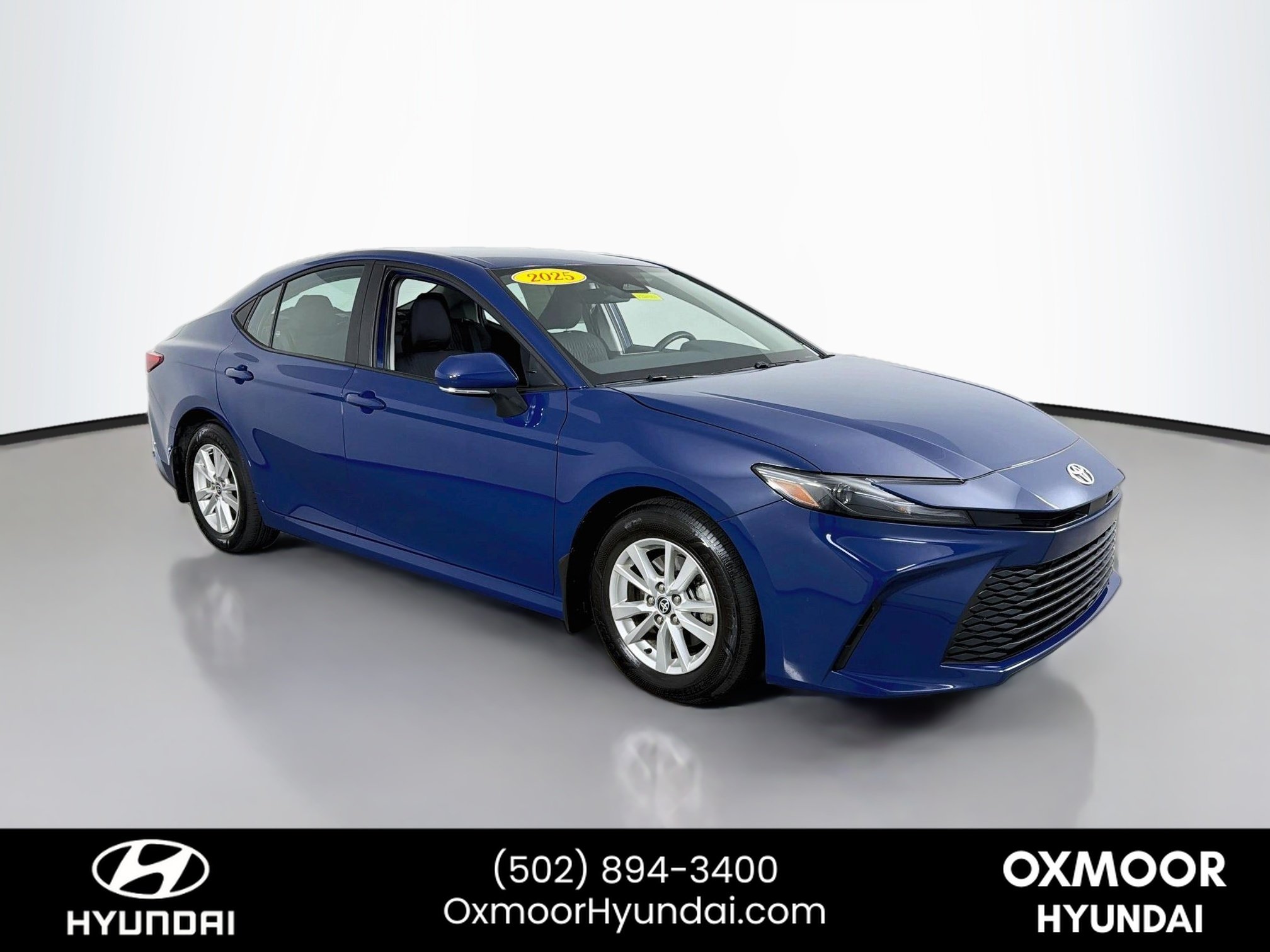 Used 2025 Reservoir Blue Toyota LE image 1