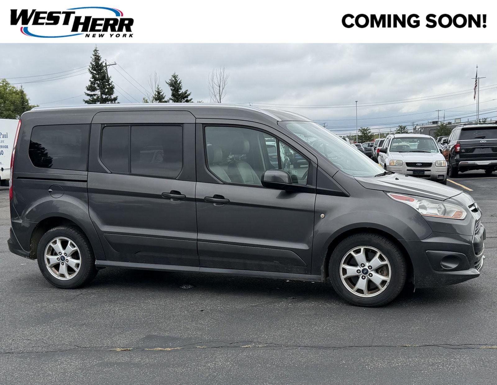 Used 2016 Magnetic Metallic Ford Titanium image 1