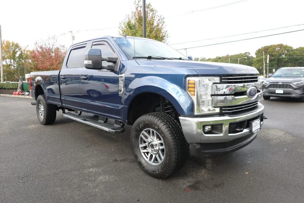 Used 2019 Blue Jeans Metallic Ford LARIAT 4WD Crew Cab 6.75