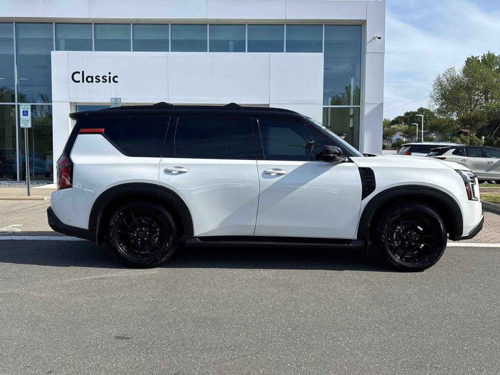 Used 2025 Aspen White Tricoat/Super Black Nissan PRO-4X image 6