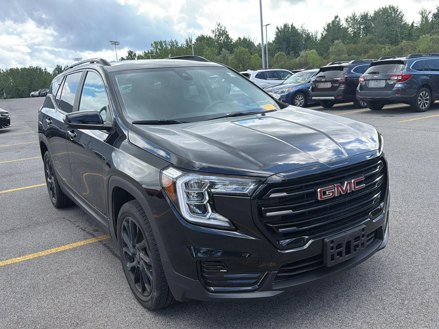Used 2023 Ebony Twilight Metallic GMC SLE image 2