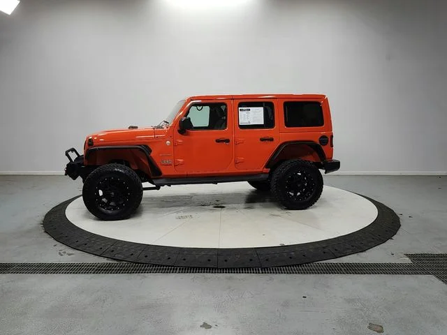 Used 2018 Orange Jeep Unlimited Sahara image 4