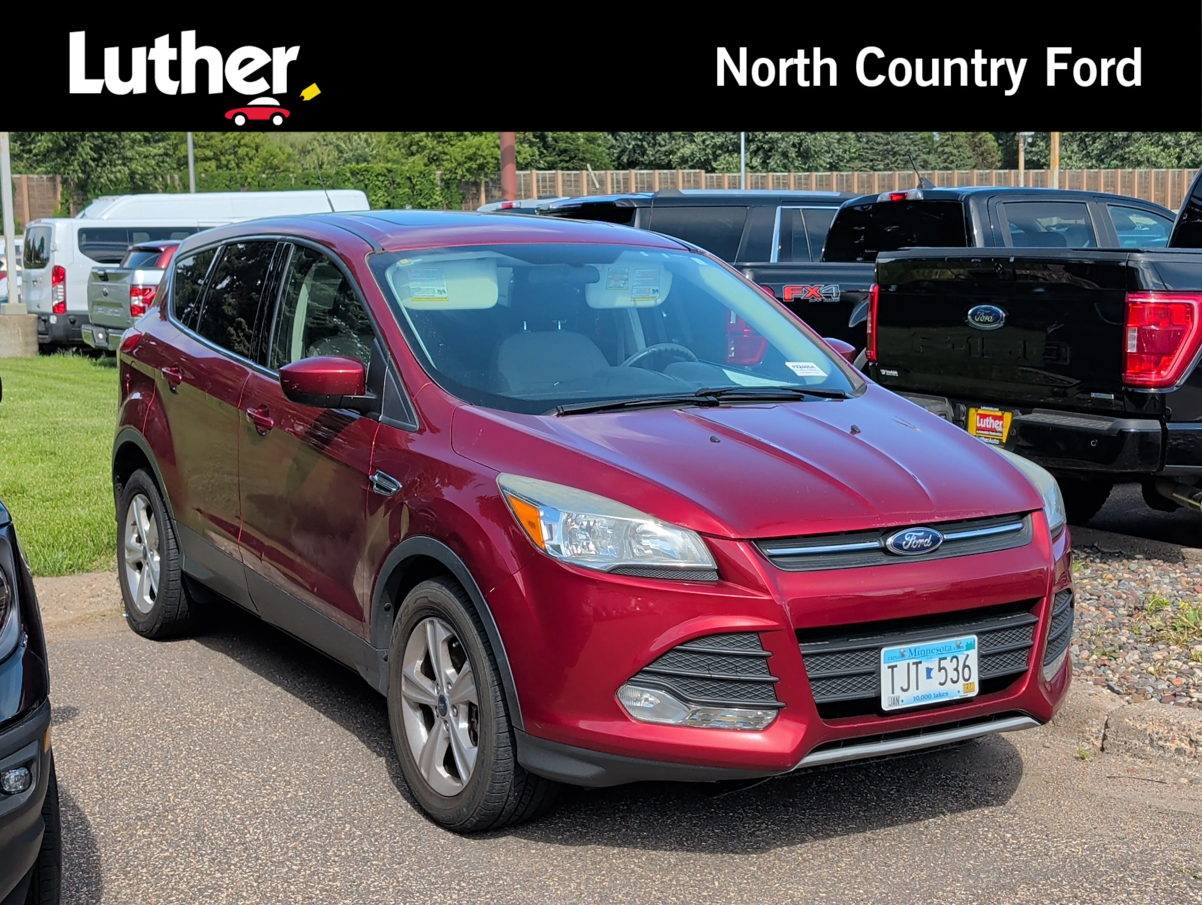 Used 2015 Ruby Red Metallic Tinted Clearcoat Ford SE image 1