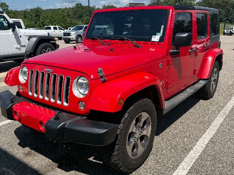 Used 2016 Firecracker Red Clearcoat Jeep Sahara image 1