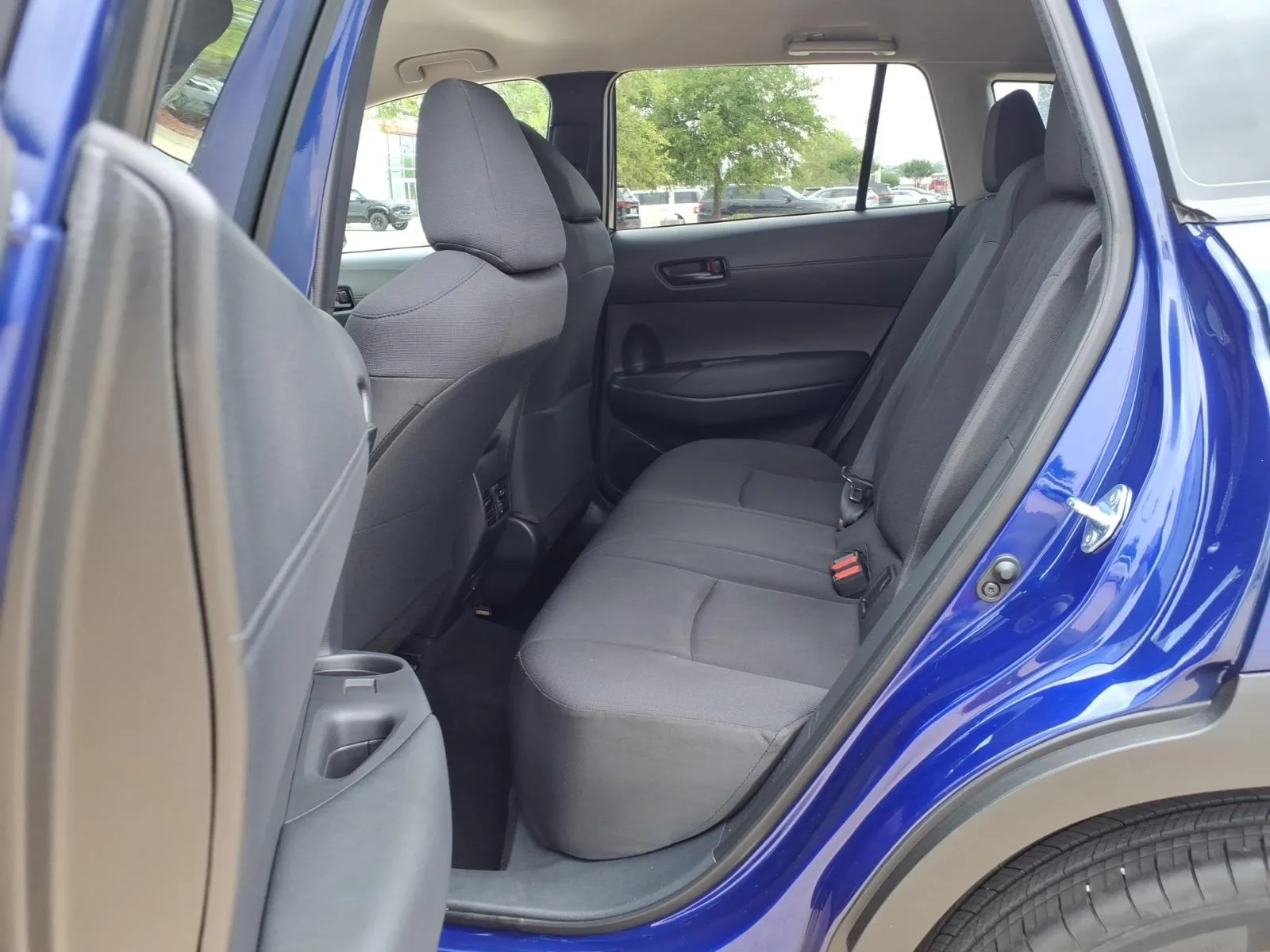 Used 2024 Blue Crush Metallic Toyota LE image 17
