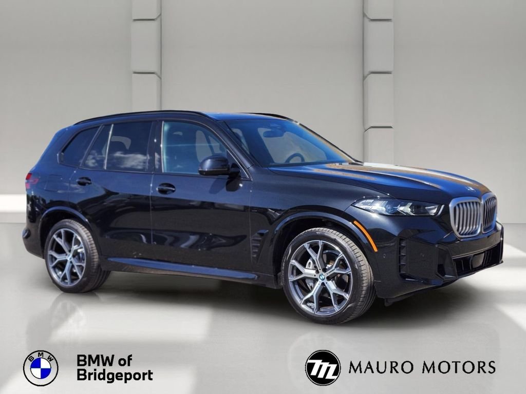 Used 2024 Black BMW xDrive40i image 1